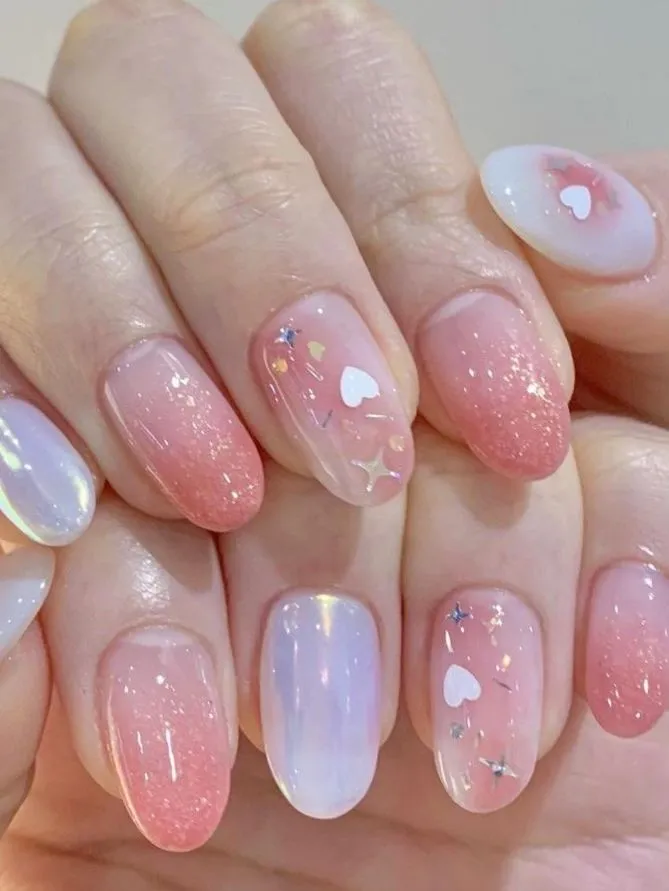 Mẫu nail pastel hồng nhạt dịu dàng cho mùa hè 2025 tại NguyenBeauty